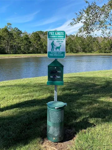 a view of a swimming pool and a yard