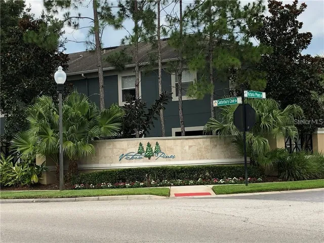 a view of a fountain in front of a house