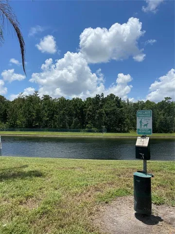 a living room with lots of furniture and a large window