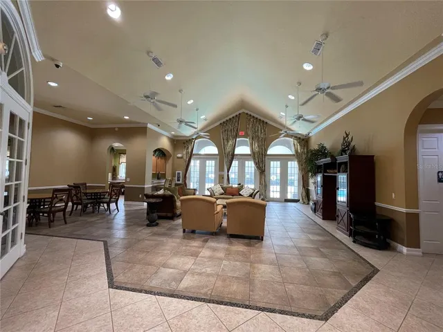 a living room with furniture gym equipment and a view of living room
