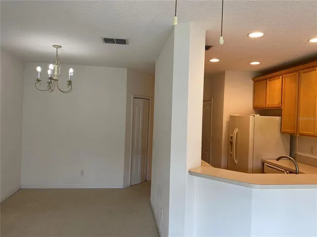 a view of a lobby with black carpet