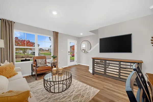 a view of a dining room with furniture and wooden floor