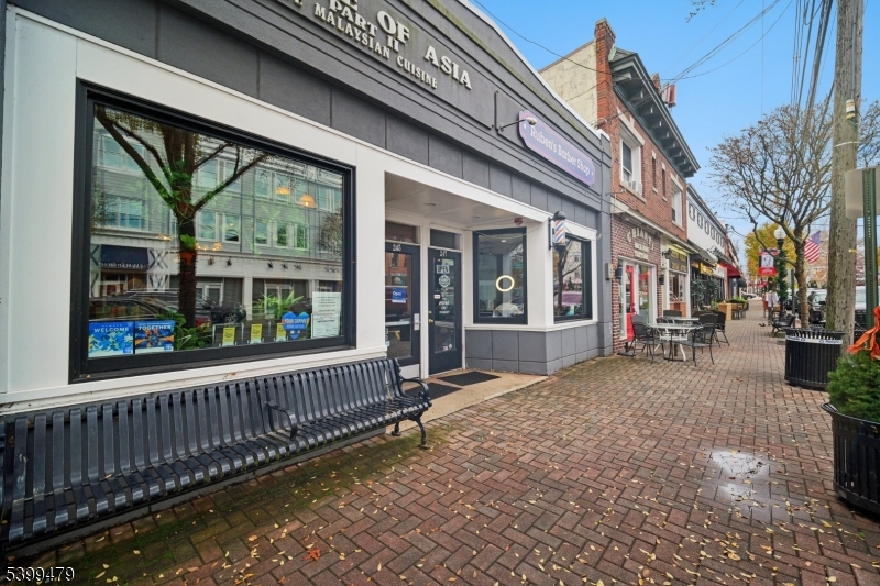 246 Main Street, Unit 202 Chatham, NJ 07928 - Photo 17 of 29 a view of a house with a large window and wooden fence