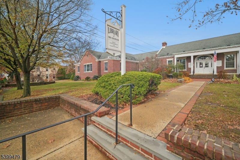 246 Main Street, Unit 201 Chatham, NJ 07928 - Photo 20 of 28 a front view of a house with garden