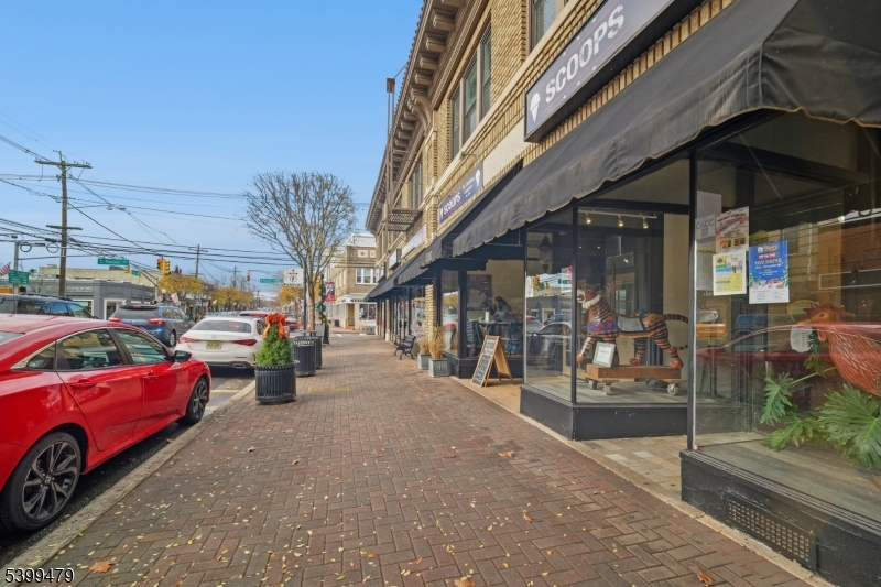 246 Main Street, Unit 202 Chatham, NJ 07928 - Photo 22 of 29 a view of a cars park in front of a building