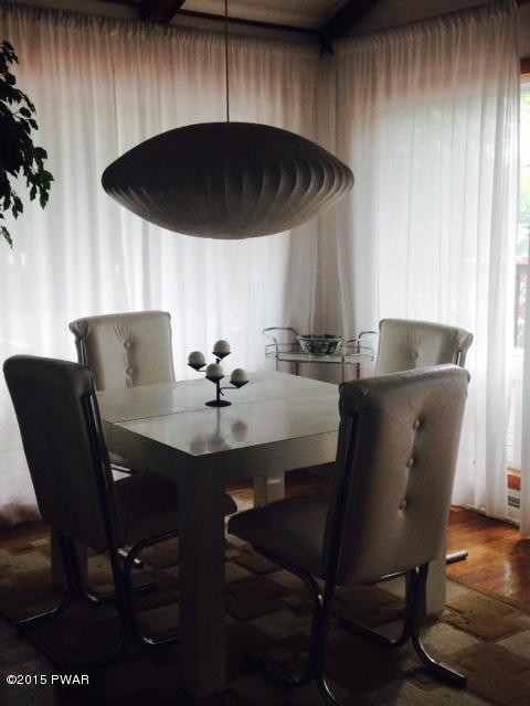 162 Beech Road Dingmans Ferry, PA 18328 - Photo 14 of 15 a table and chairs in a kitchen