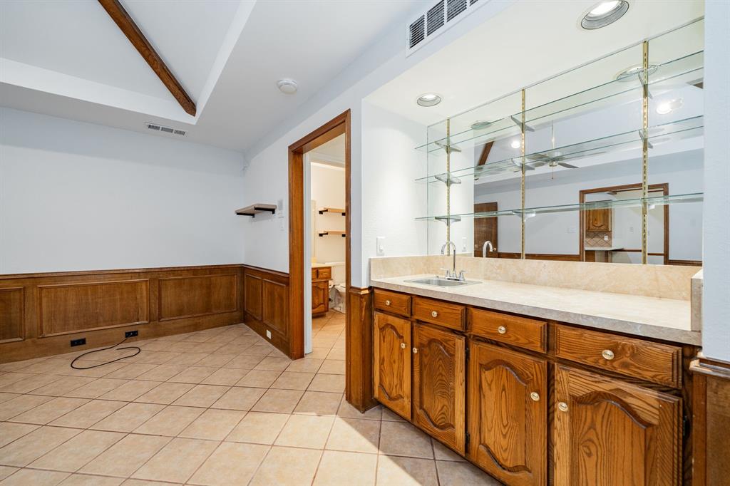 8304 Navigation Drive Rowlett, TX 75088 - Photo 18 of 40 Bathroom with vanity, light tile patterned floors, wainscoting, and recessed lighting
