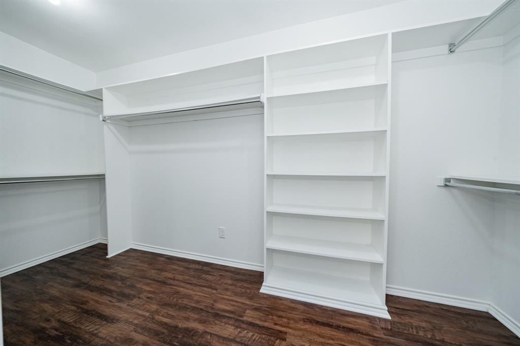 8304 Navigation Drive Rowlett, TX 75088 - Photo 29 of 40 Spacious closet featuring dark wood-type flooring