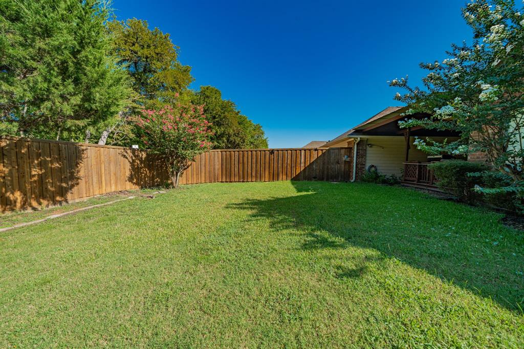 8304 Navigation Drive Rowlett, TX 75088 - Photo 39 of 40 View of fenced backyard