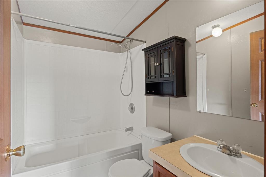 2903 Centaurus Way Granbury, TX 76048 - Photo 17 of 31 Full bath with vanity and bathtub / shower combination