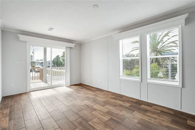 a view of an empty room with a window