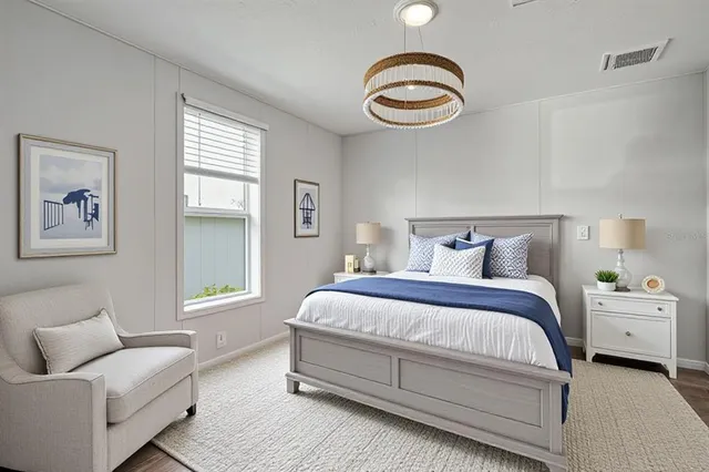 a spacious bedroom with a bed and a couch