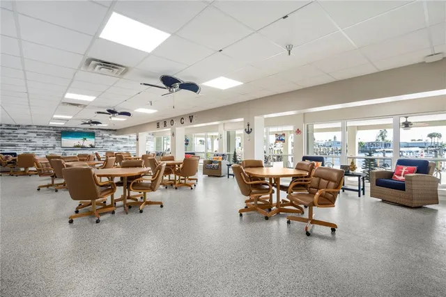 a very nice looking living room with a large window and furniture