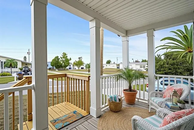 a balcony with furniture and garden view