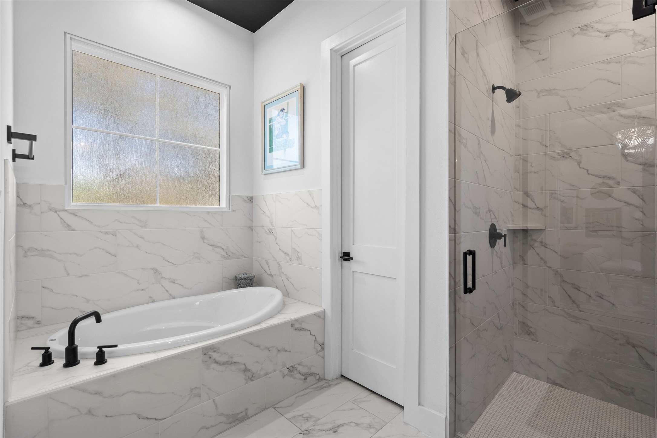 170 Bunker Rnch Boulevard, Unit 28 Dripping Springs, TX 78620 - Photo 20 of 37 Bathroom with a bath, a marble finish shower, and light marble finish flooring