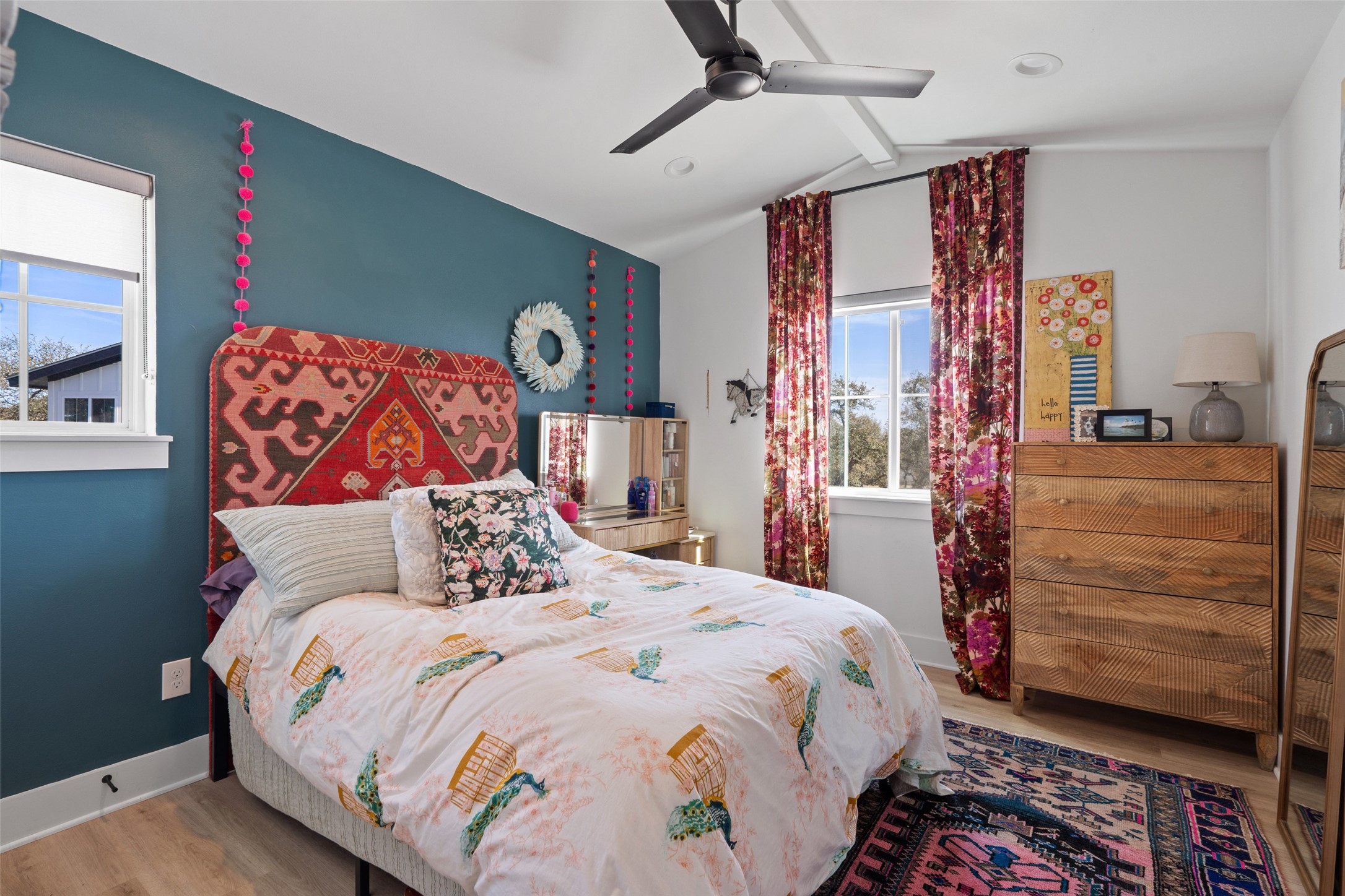 170 Bunker Rnch Boulevard, Unit 28 Dripping Springs, TX 78620 - Photo 21 of 37 Bedroom with light wood-style floors, a ceiling fan, and beamed ceiling
