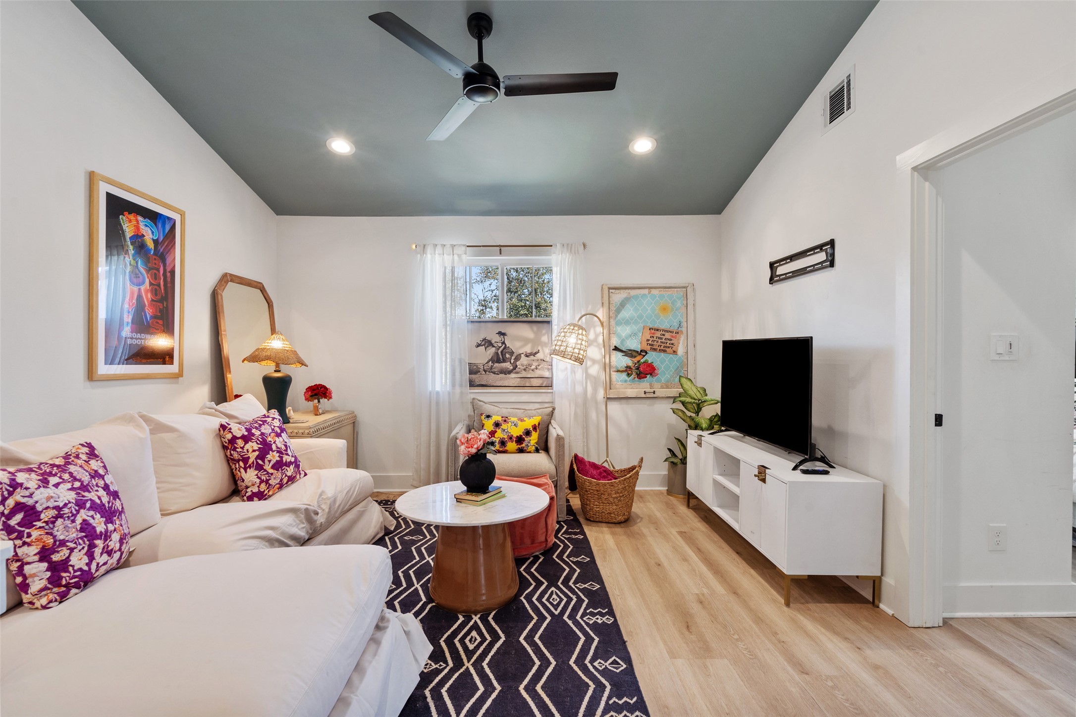 170 Bunker Rnch Boulevard, Unit 28 Dripping Springs, TX 78620 - Photo 26 of 37 Living room with lofted ceiling, light wood-style flooring, a ceiling fan, and recessed lighting
