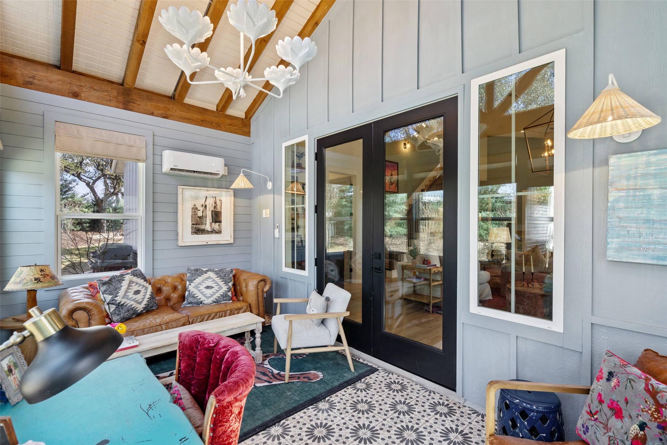 170 Bunker Rnch Boulevard, Unit 28 Dripping Springs, TX 78620 - Photo 28 of 37 Sunroom / solarium featuring vaulted ceiling with beams, hanging lights, and a wall mounted mini split