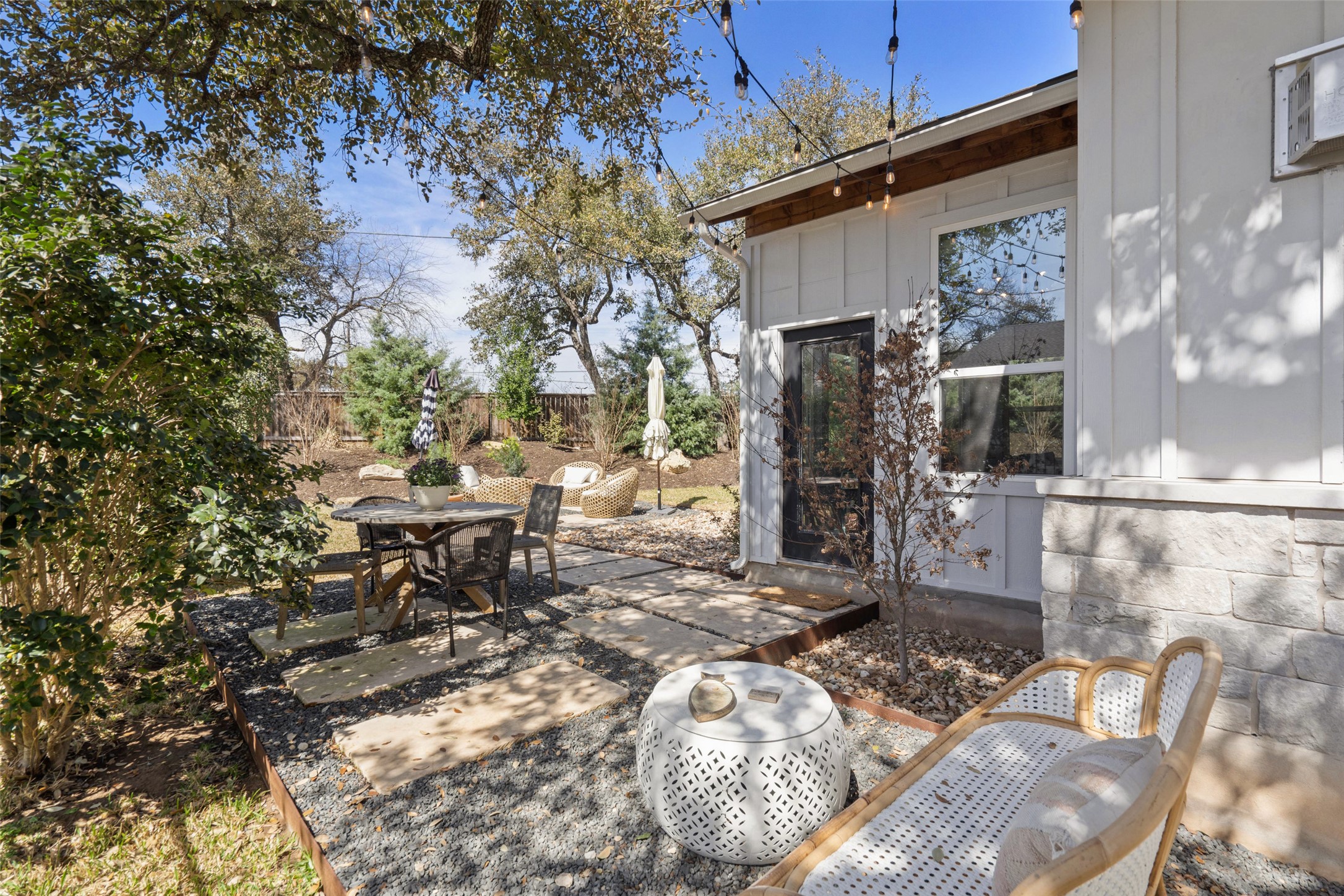 170 Bunker Rnch Boulevard, Unit 28 Dripping Springs, TX 78620 - Photo 30 of 37 Fenced backyard featuring outdoor dining space and a patio area