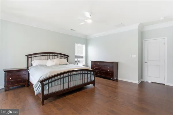 a bedroom with a bed and dresser
