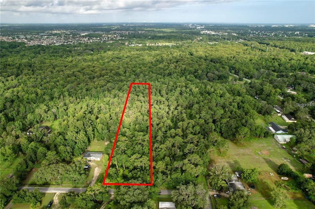 848 Hamilton Drive Orlando, FL 32833 - Photo 4 of 9 a view of a lush green field