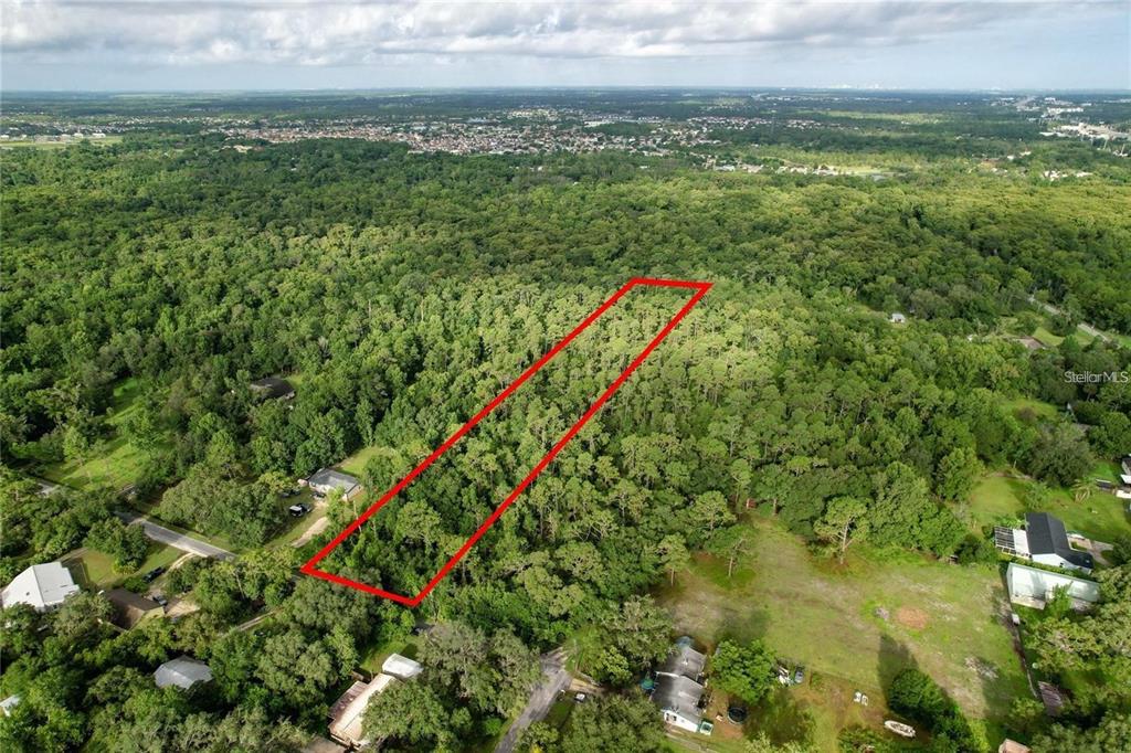 848 Hamilton Drive Orlando, FL 32833 - Photo 5 of 9 a view of a lush green space with sea