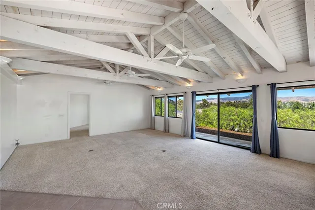a view of an empty room with a balcony