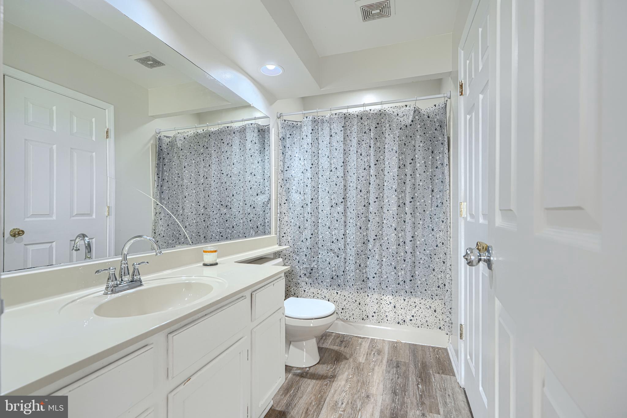 315 Overlea Place Abingdon, MD 21009 - Photo 26 of 56 a bathroom with a sink a toilet a shower and a window