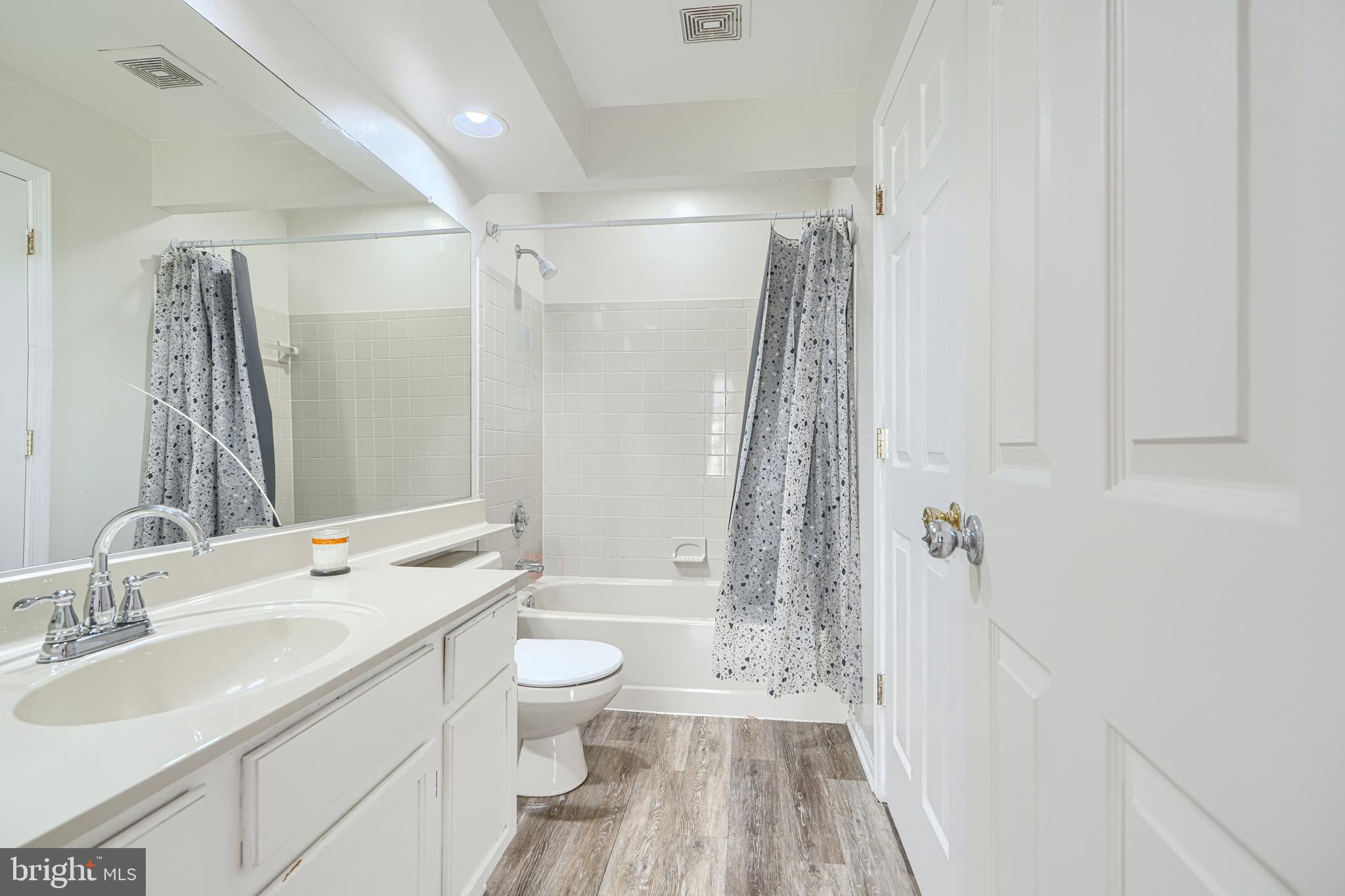 315 Overlea Place Abingdon, MD 21009 - Photo 29 of 56 a bathroom with a sink a toilet a mirror a vanity and shower