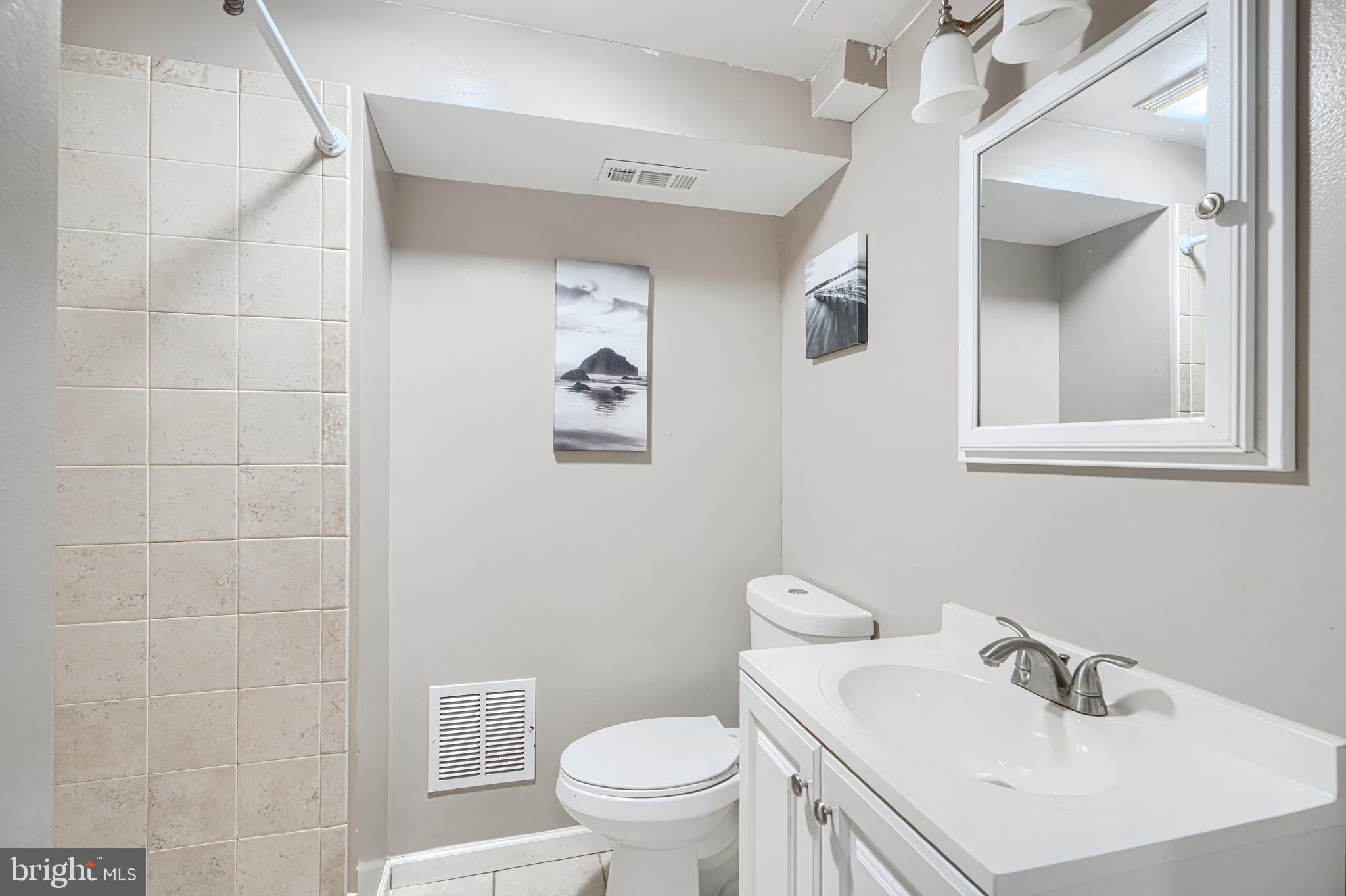 315 Overlea Place Abingdon, MD 21009 - Photo 46 of 56 a bathroom with a sink mirror and toilet