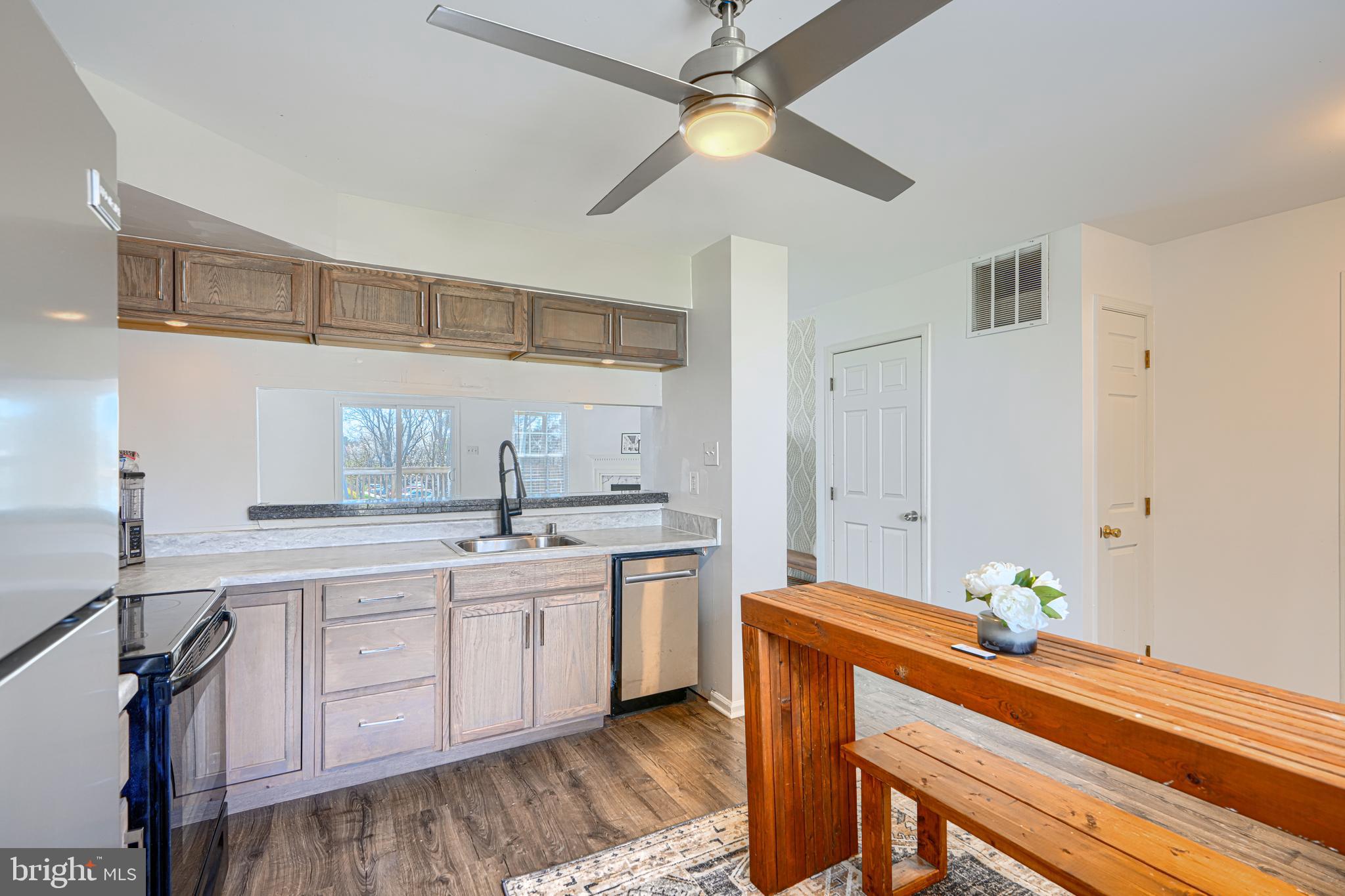 315 Overlea Place Abingdon, MD 21009 - Photo 10 of 56 a kitchen with white cabinets and chandelier