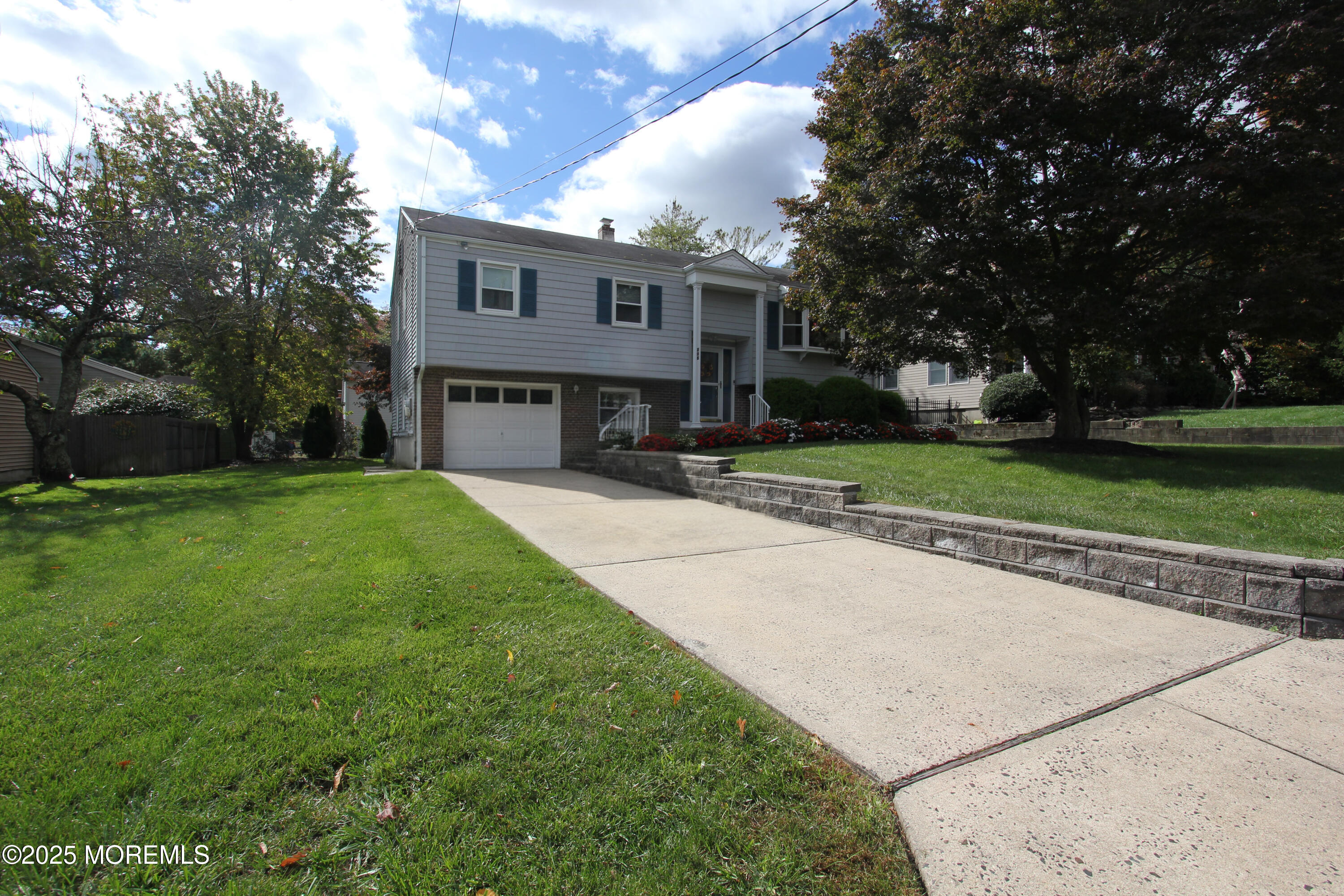 a view of house with outdoor space and tree s