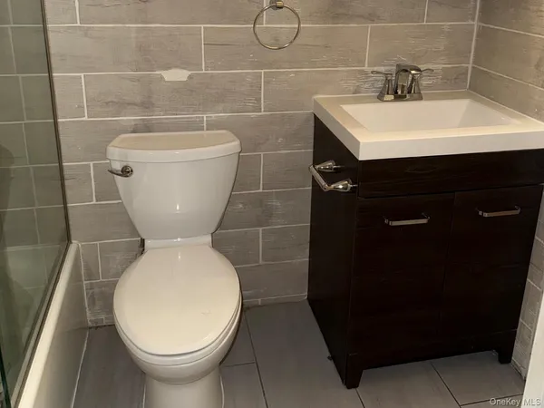 a bathroom with a toilet and a sink