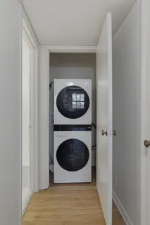 a view of a hallway with washer and dryer