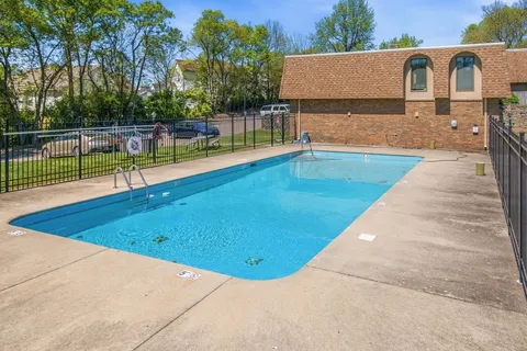 a view of swimming pool with a backyard