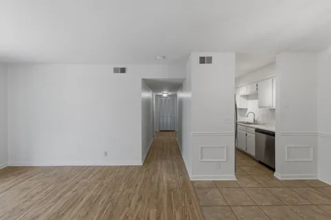 a view of a kitchen with a sink and an oven