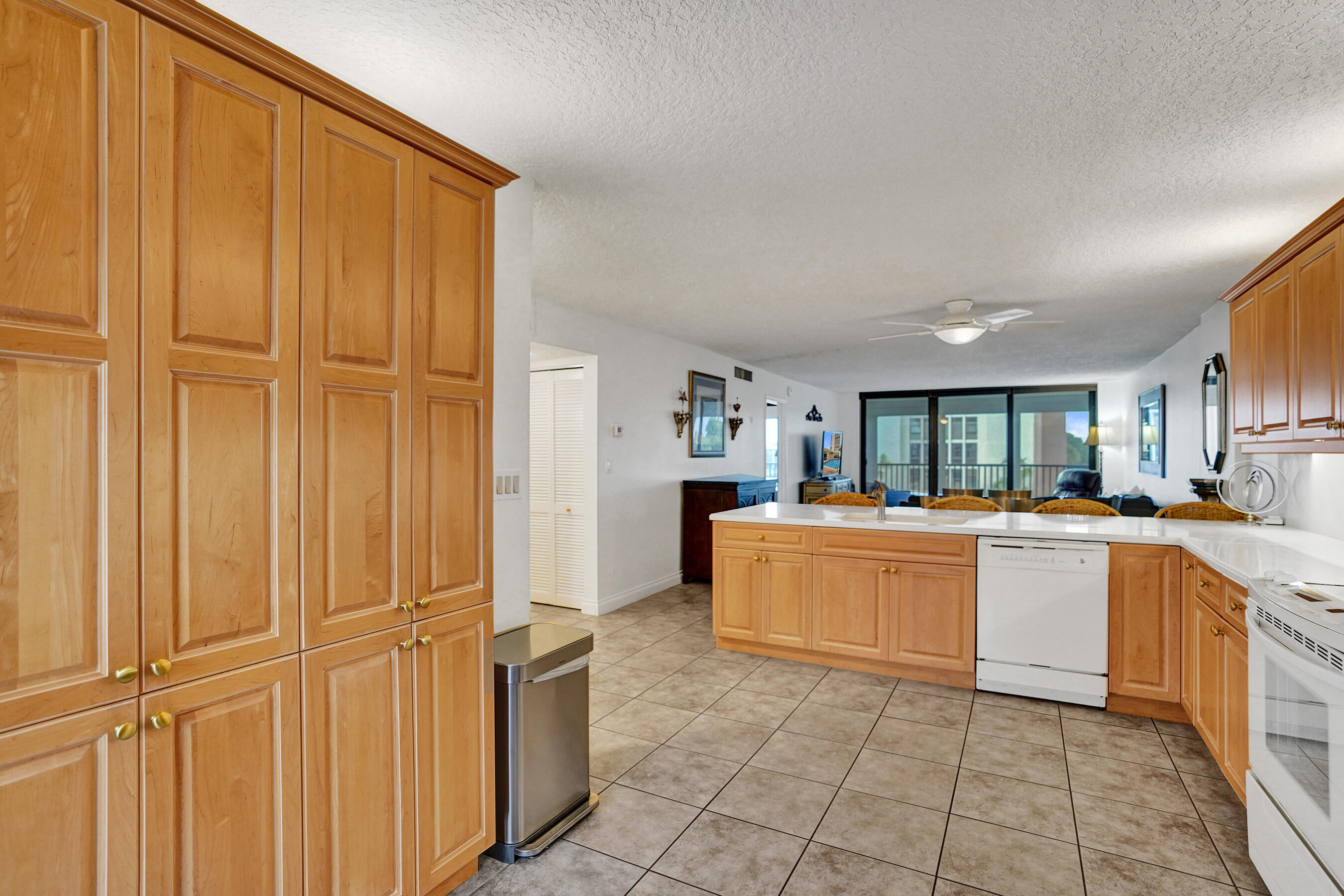 1627 Riverview Road, Unit 410 Deerfield Beach, FL 33441 - Photo 17 of 56 a kitchen with stainless steel appliances granite countertop a refrigerator and cabinets