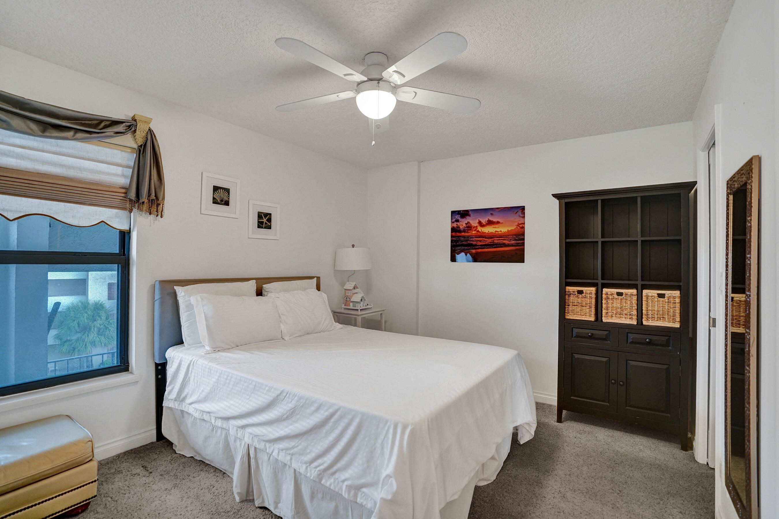 1627 Riverview Road, Unit 410 Deerfield Beach, FL 33441 - Photo 20 of 56 a bedroom with a bed and a window