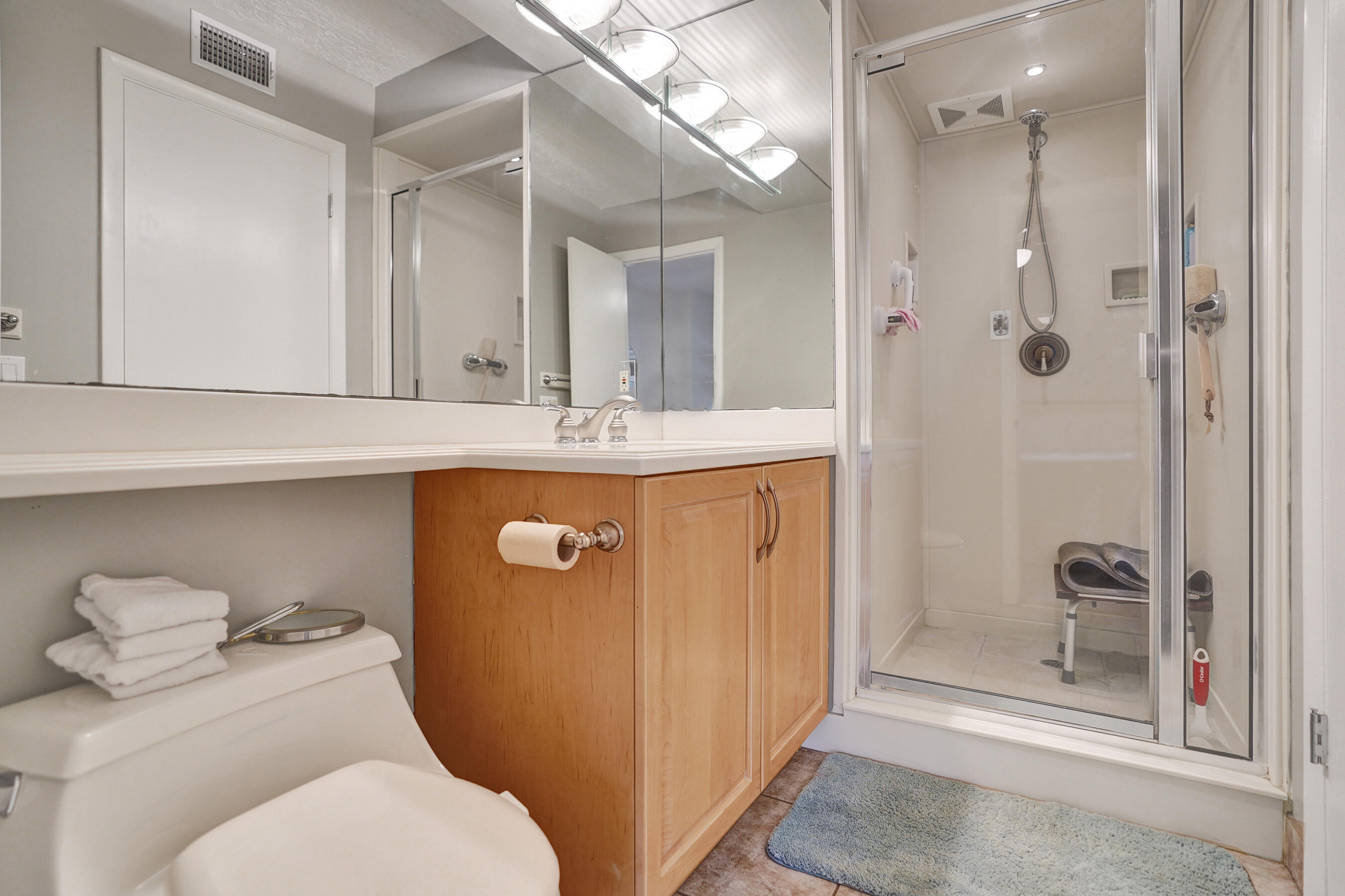 1627 Riverview Road, Unit 410 Deerfield Beach, FL 33441 - Photo 21 of 56 a bathroom with a granite countertop toilet sink and shower