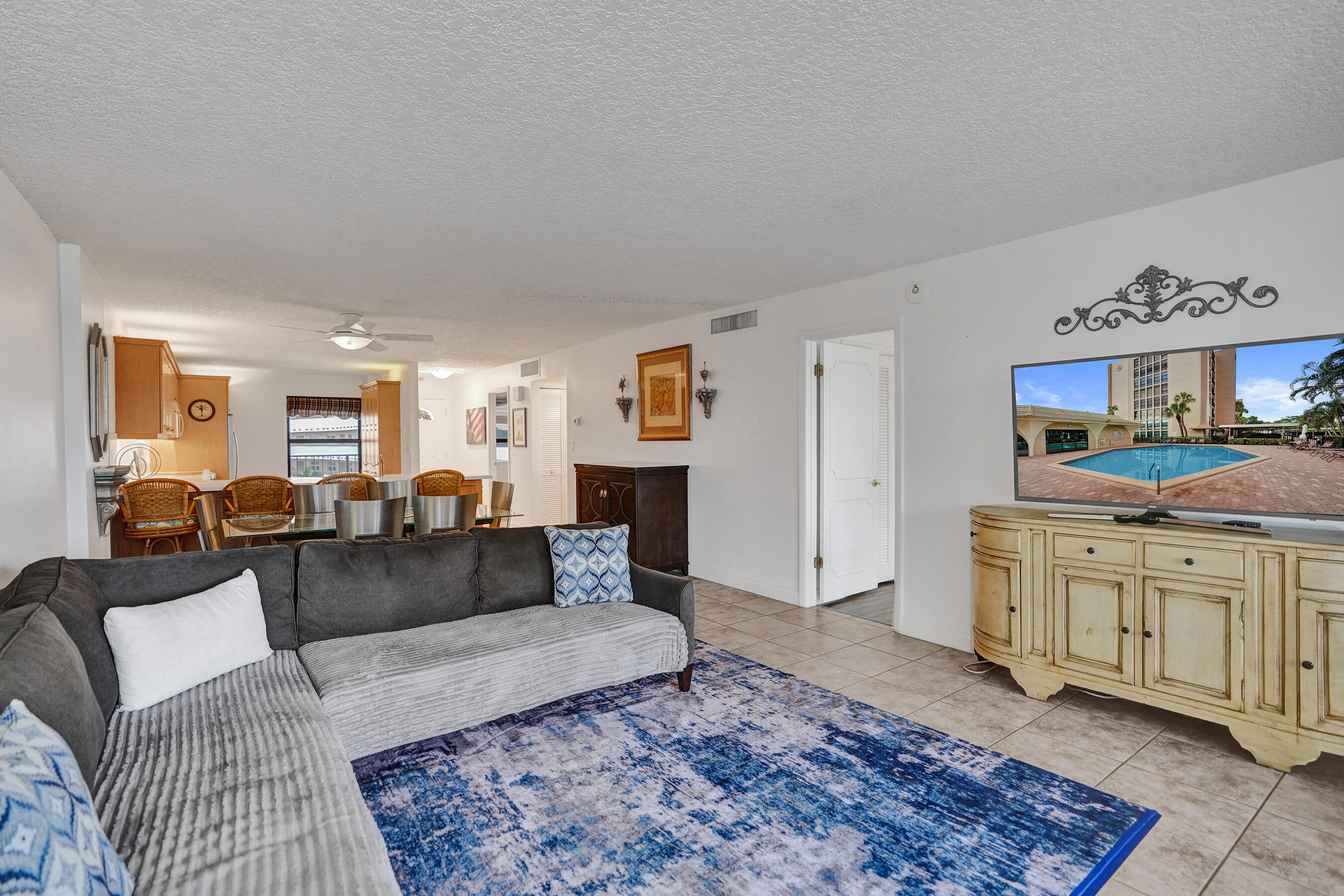 1627 Riverview Road, Unit 410 Deerfield Beach, FL 33441 - Photo 30 of 56 a living room with furniture and a rug