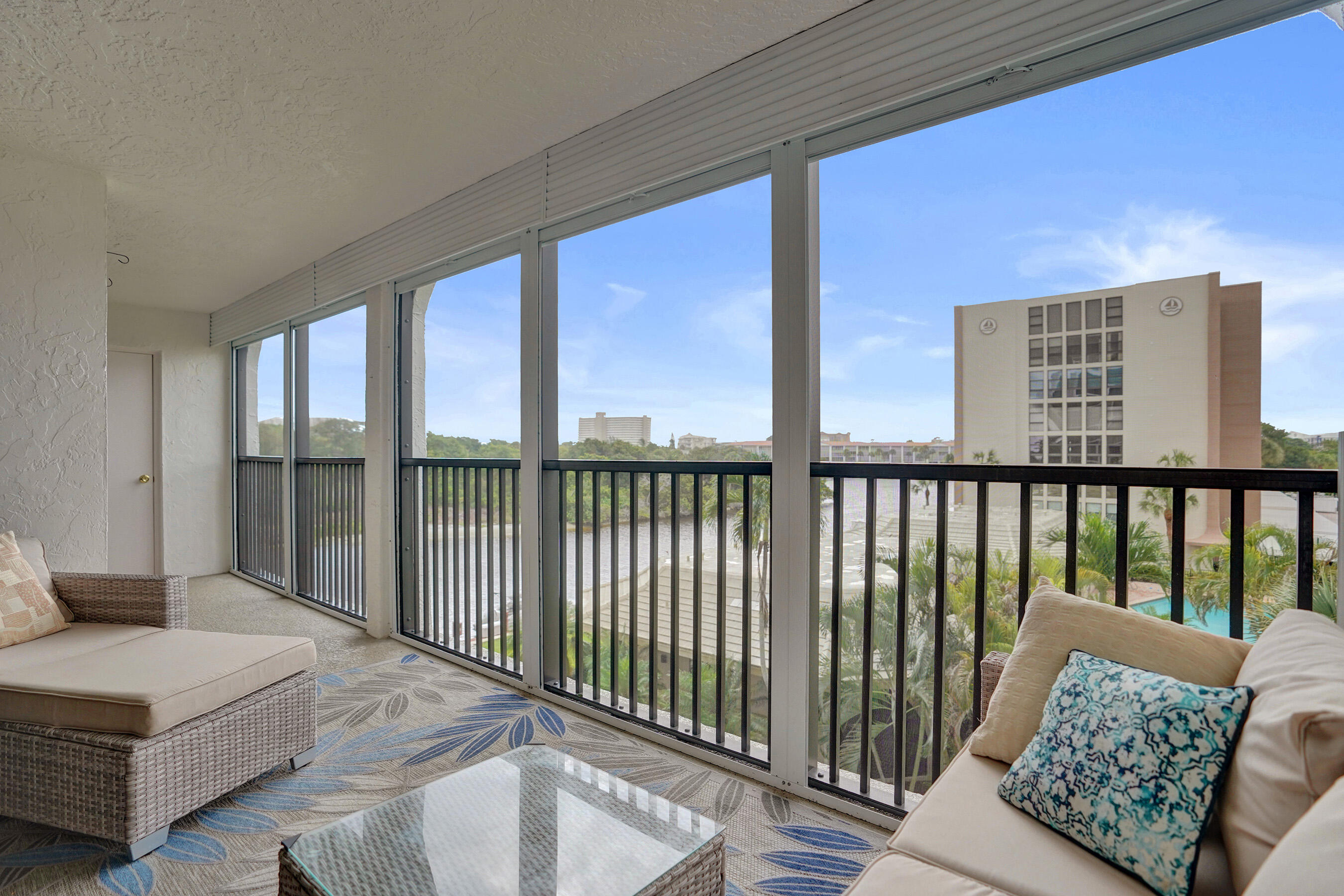 1627 Riverview Road, Unit 410 Deerfield Beach, FL 33441 - Photo 34 of 56 a living room with furniture and a floor to ceiling window