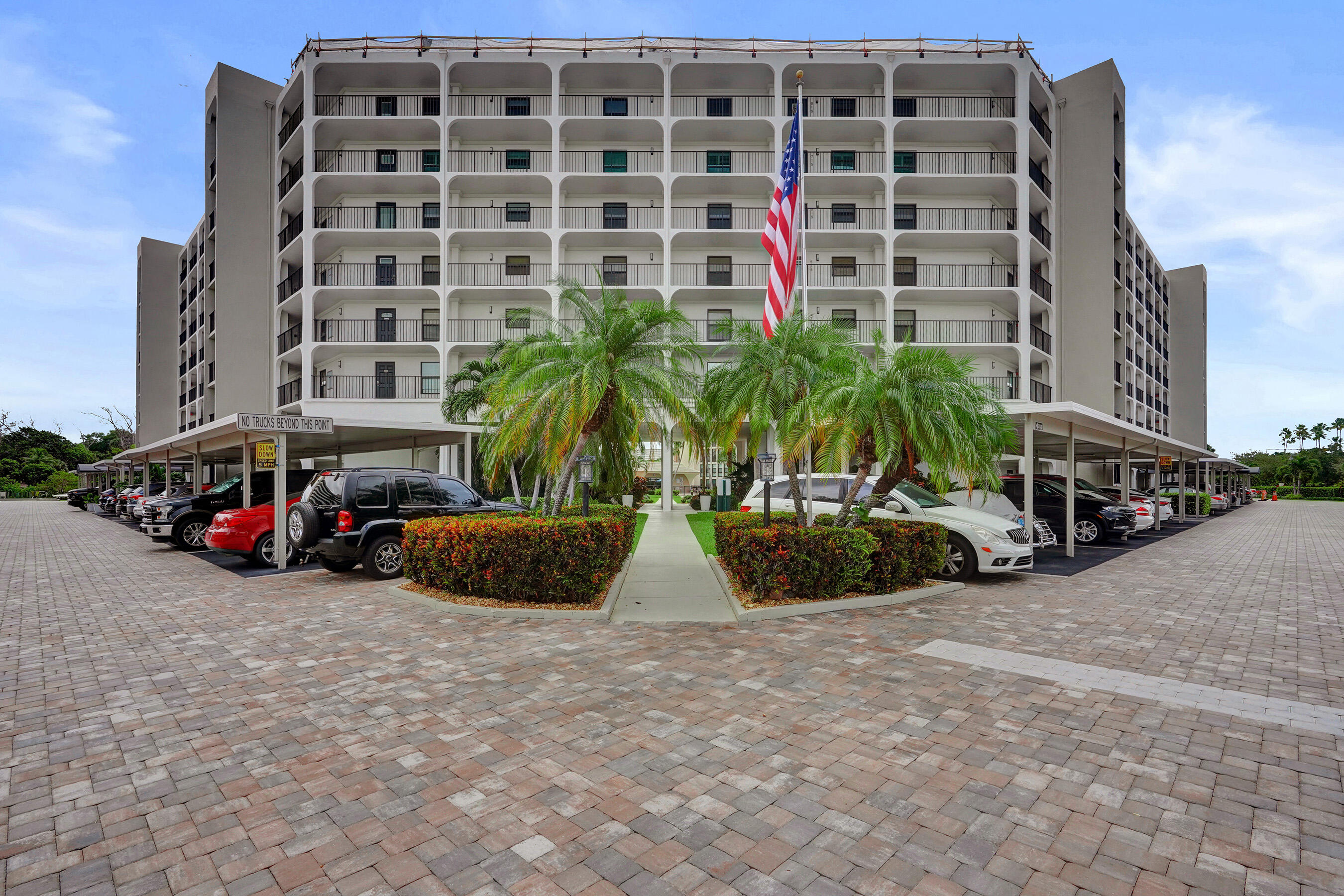 1627 Riverview Road, Unit 410 Deerfield Beach, FL 33441 - Photo 4 of 56 a view of car parked in front of building