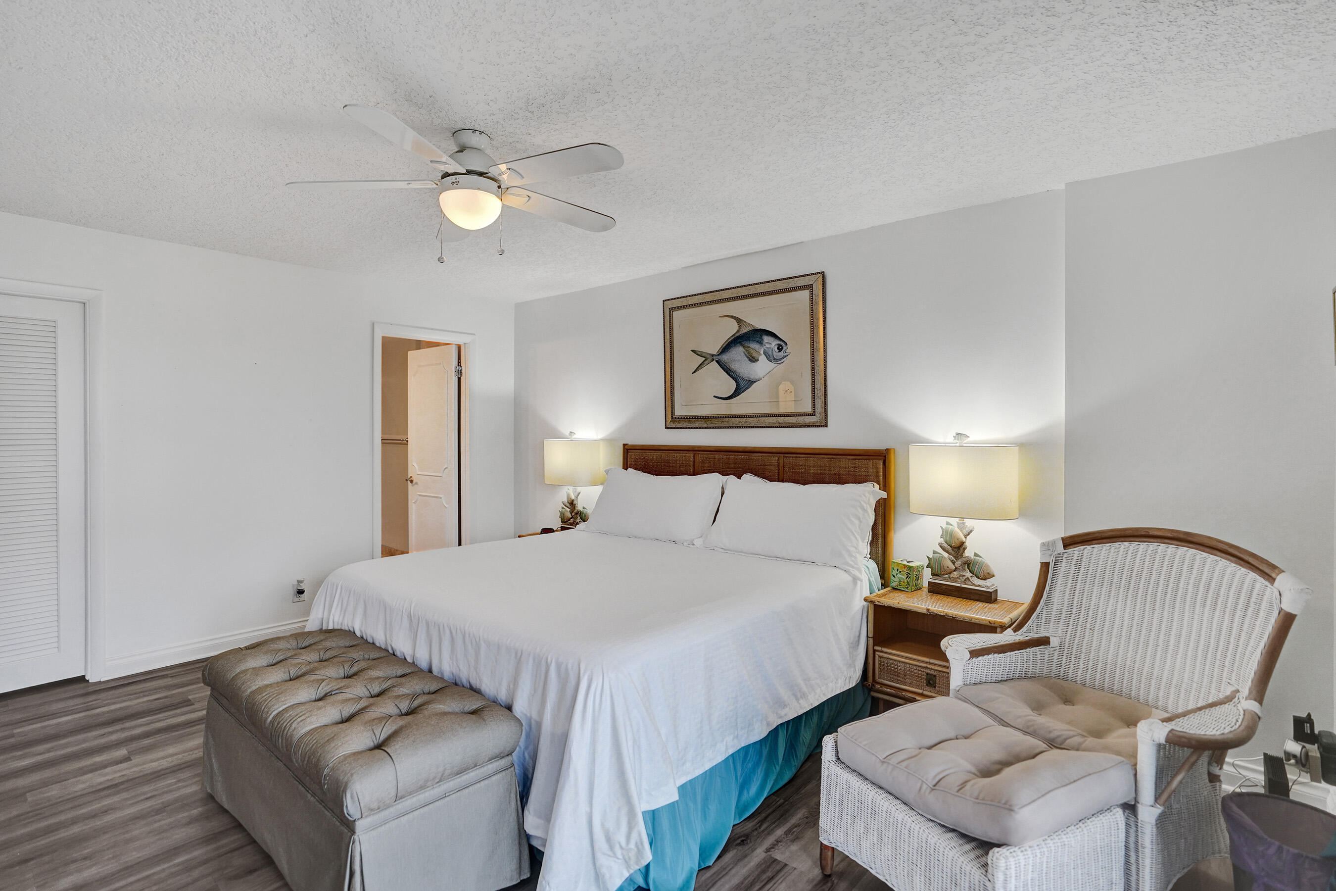 1627 Riverview Road, Unit 410 Deerfield Beach, FL 33441 - Photo 42 of 56 a bedroom with a bed and chair