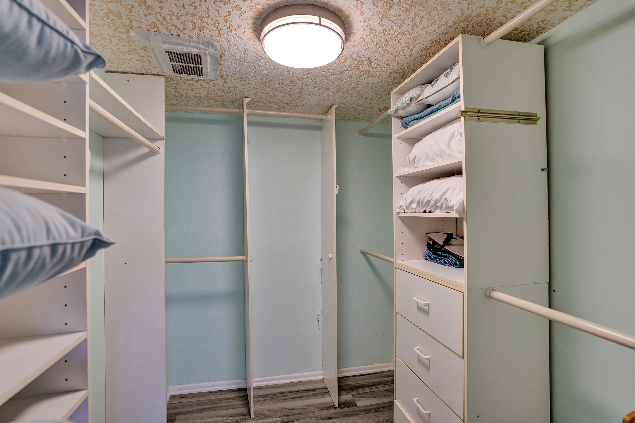 1627 Riverview Road, Unit 410 Deerfield Beach, FL 33441 - Photo 48 of 56 a view of walk in closet with clothes and shoes