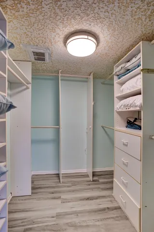 a view of a patio with chair and table of the backyard
