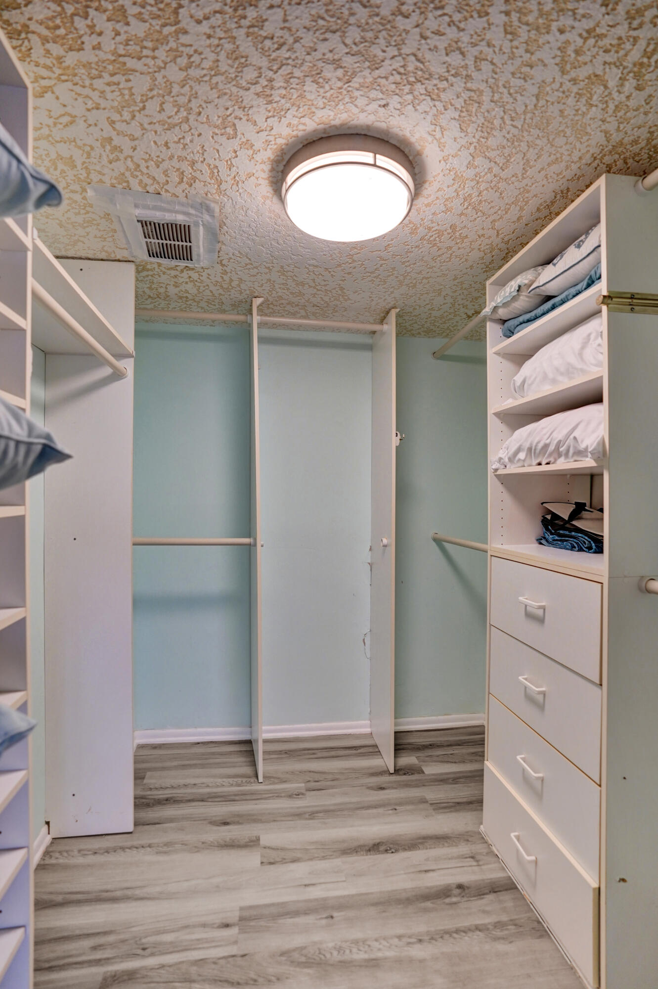 1627 Riverview Road, Unit 410 Deerfield Beach, FL 33441 - Photo 49 of 56 a view of walk in closet with empty racks