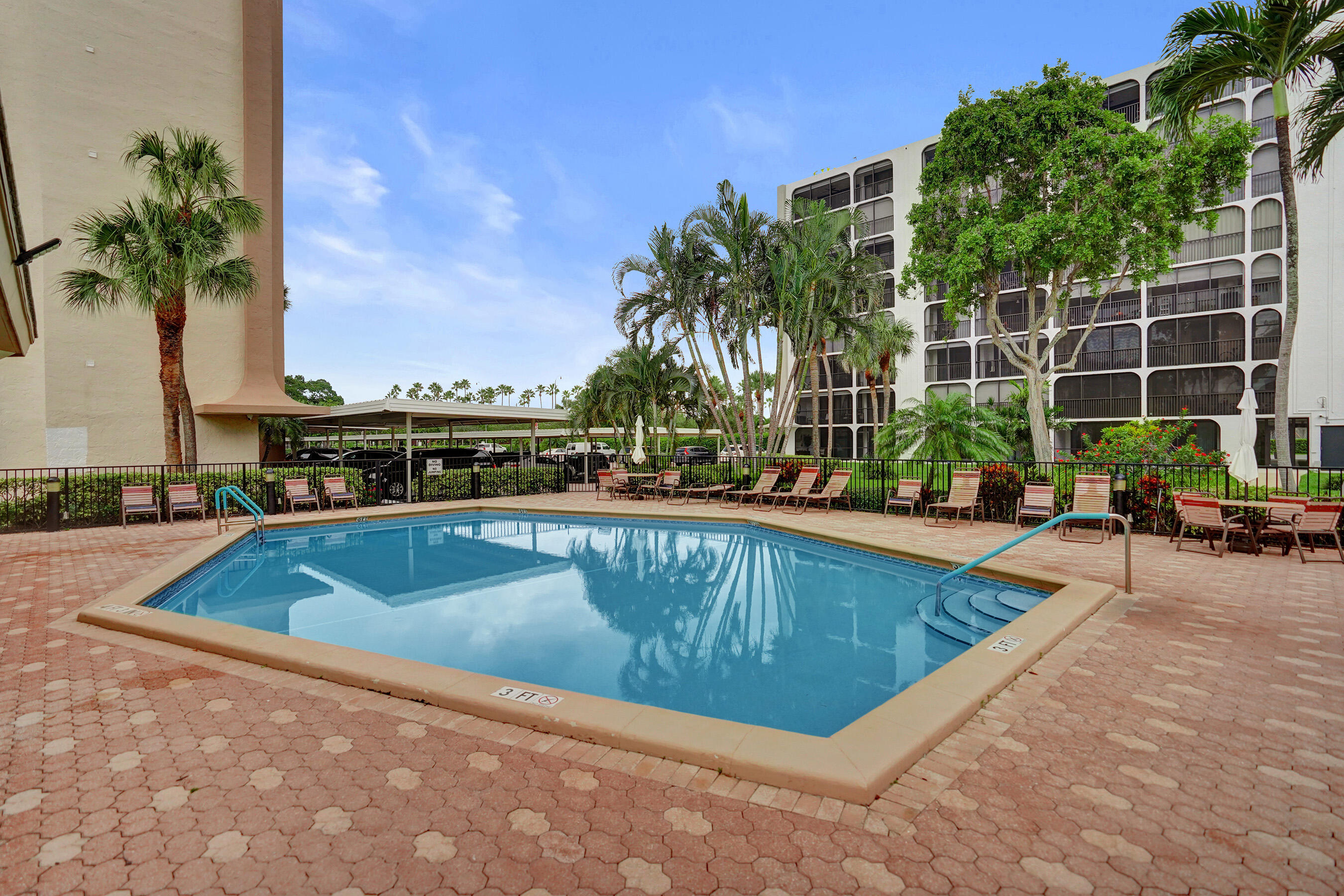1627 Riverview Road, Unit 410 Deerfield Beach, FL 33441 - Photo 52 of 56 a view of swimming pool with chairs