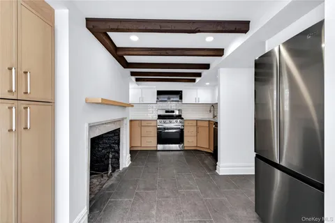 a kitchen with a refrigerator stove and oven