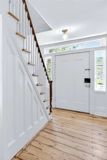 a view of entryway with wooden floor