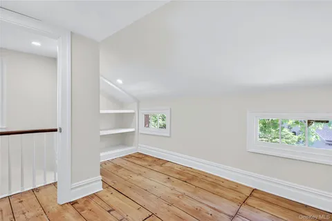 a room with a bed and a window